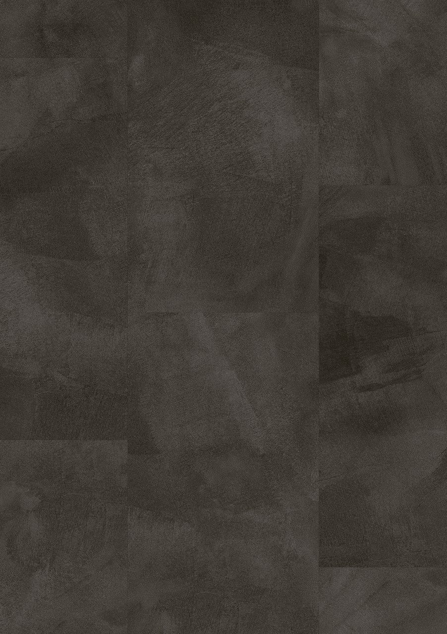 Vinyylilaatta Quick-Step Illume Soft Graphite asennettuna modernin kodin lattialle – tumma grafiitinharmaa sävy ja elegantti, hillitty kivimäinen/betonimainen design hienovaraisella tekstuurilla.