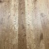 Rustic oak plank parquet – the brushed and oiled surface brings out the natural wood grain. Parquet floor oak Markant 1-strip, bevelled, brushed and oiled, 189 mm, installed – natural tone with lively knots and natural cracks (rustic grade)
