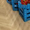 spc-herringbone-flooring-quick-step-ciro-botanic-beige SPC herringbone flooring Quick-Step Ciro Botanic Beige installed on floor and berrys and jam in boxes