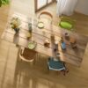 lvt-floors-quick-step-bloom-brushed-oak-honey LVT Floors Quick Step Bloom Brushed Oak Honey installed on a dining room floor. Dining table with breakfast and flowers.